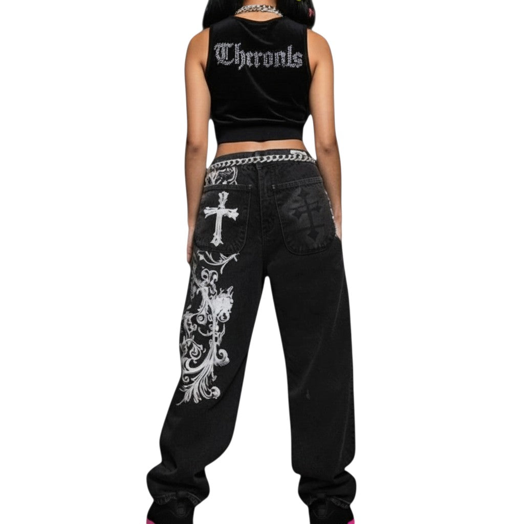 AuraXclusive baggy black denim jeans with white gothic cross and floral embroidery, featuring a loose Y2K fit.