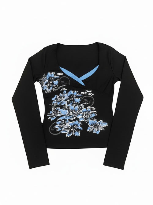 AuraXclusive black long sleeve top with a cross V-neckline, blue floral botanical print, and Y2K-inspired style.