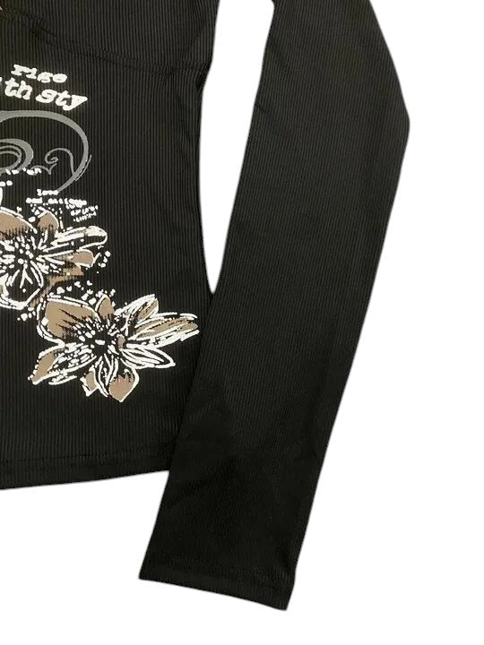 AuraXclusive black long-sleeve slim-fit top featuring a retro floral graphic print and ribbed knit texture.