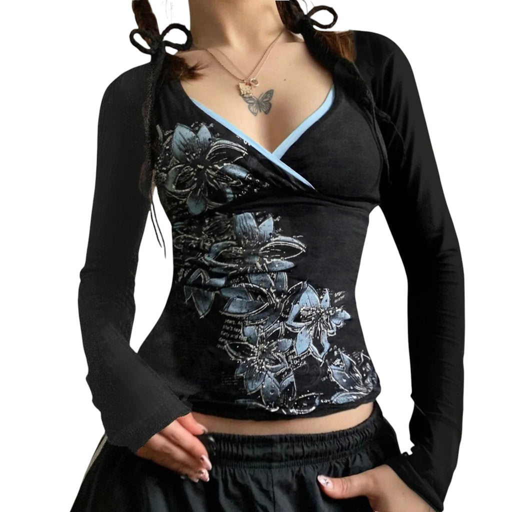 AuraXclusive slim-fit black long-sleeve top with a cross V-neck, featuring blue floral patterns and trim.