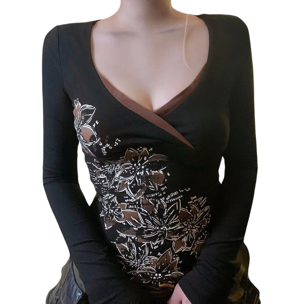 AuraXclusive slim-fit long sleeve top in black with a cross V-neck and white floral graphic print for women.