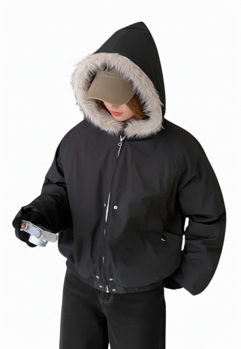 AuraXclusive women's black hooded winter jacket with a plush faux fur trim, zipper closure, and casual loose fit.