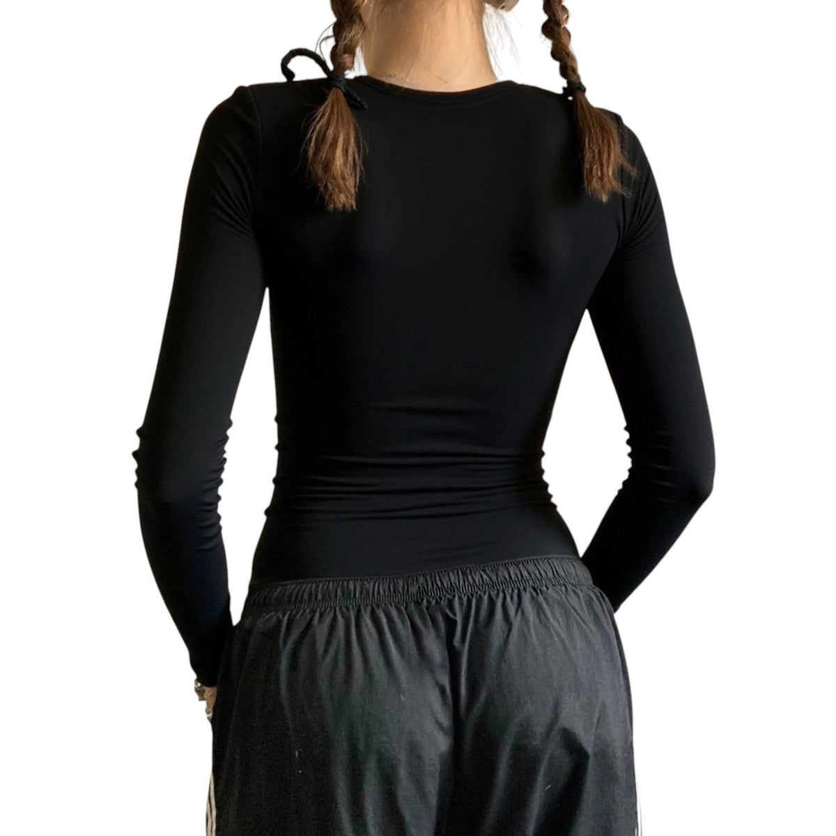 AuraXclusive slim-fit black long-sleeve base layer top worn by a woman with braided hair, back view.