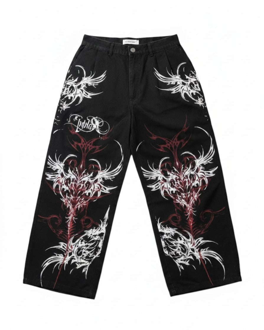 AuraXclusive black wide-leg baggy pants featuring red and white tribal flame print and gothic streetwear design.