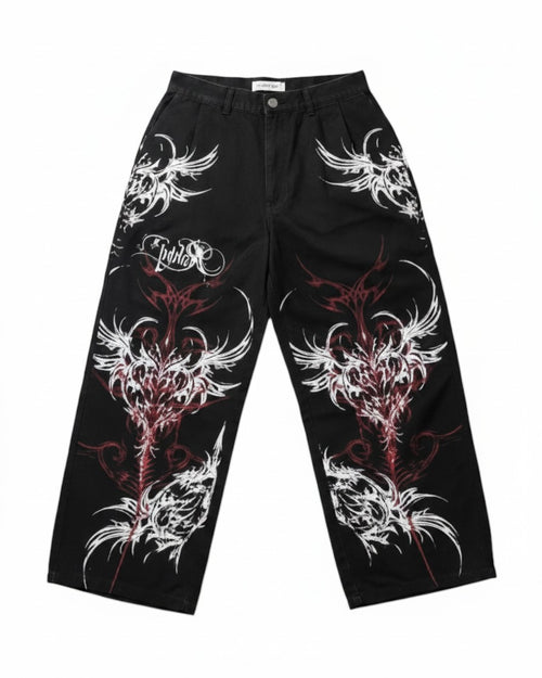 AuraXclusive black wide-leg baggy pants featuring red and white tribal flame print and gothic streetwear design.