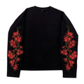 AuraXclusive black waffle knit long sleeve top featuring red cherry blossom floral embroidery on both sleeves.
