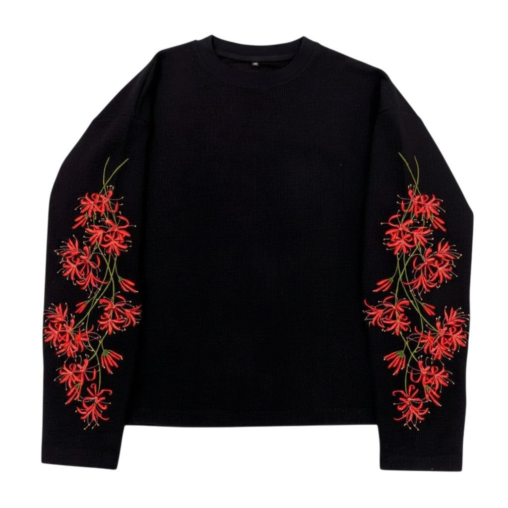 AuraXclusive black waffle knit long sleeve top featuring red cherry blossom floral embroidery on both sleeves.
