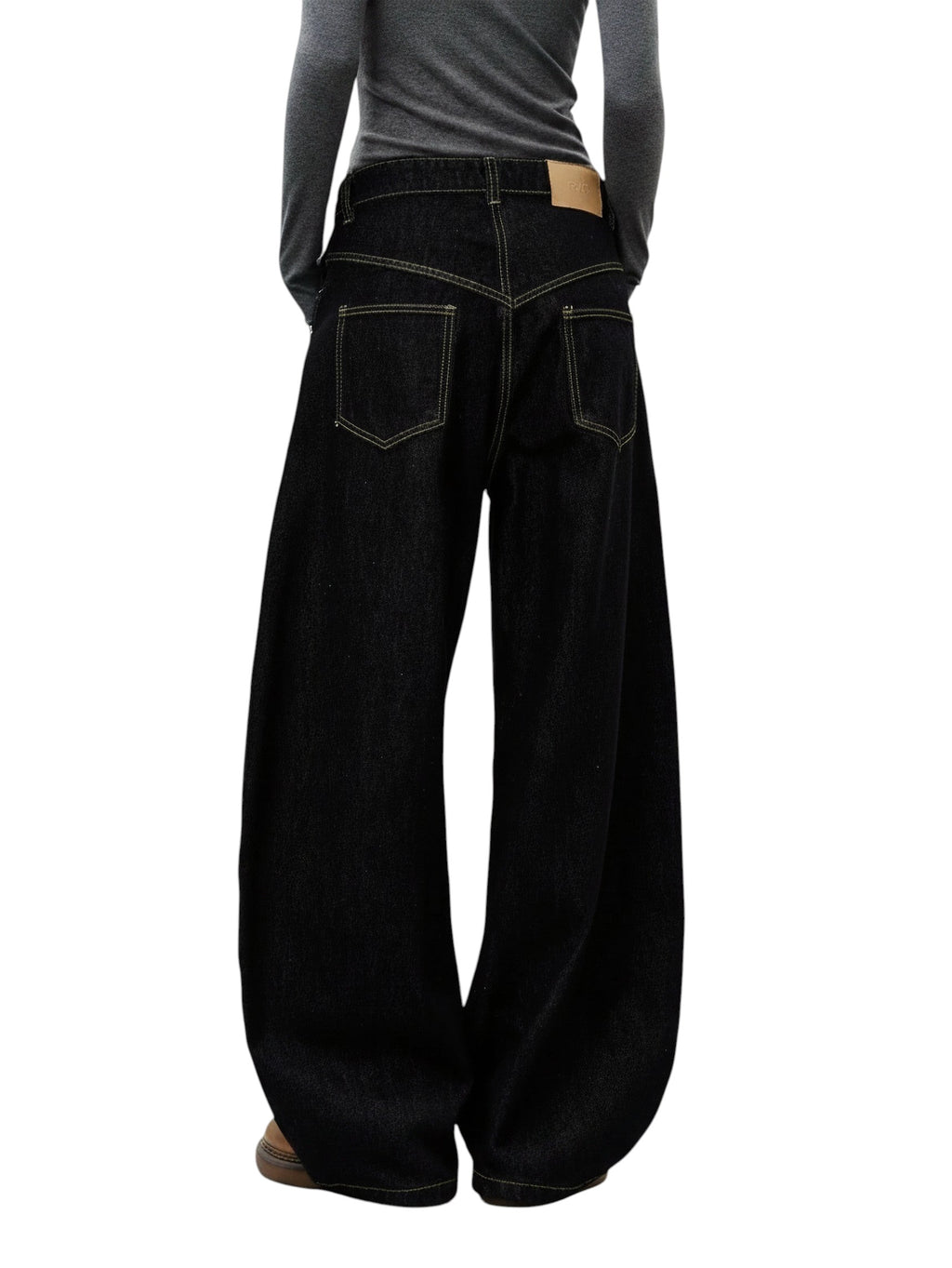 AuraXclusive black wide-leg denim jeans with contrast stitching and a high-rise waist, viewed from the back.