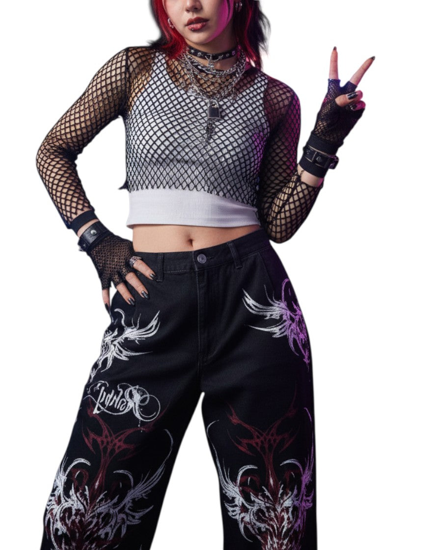 AuraXclusive model wearing Y2K gothic baggy cargo pants with red and white tribal flame print and a fishnet top