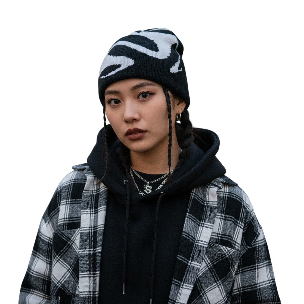 AuraXclusive unisex black and white knit beanie with a graphic tooth pattern worn by a model in streetwear style