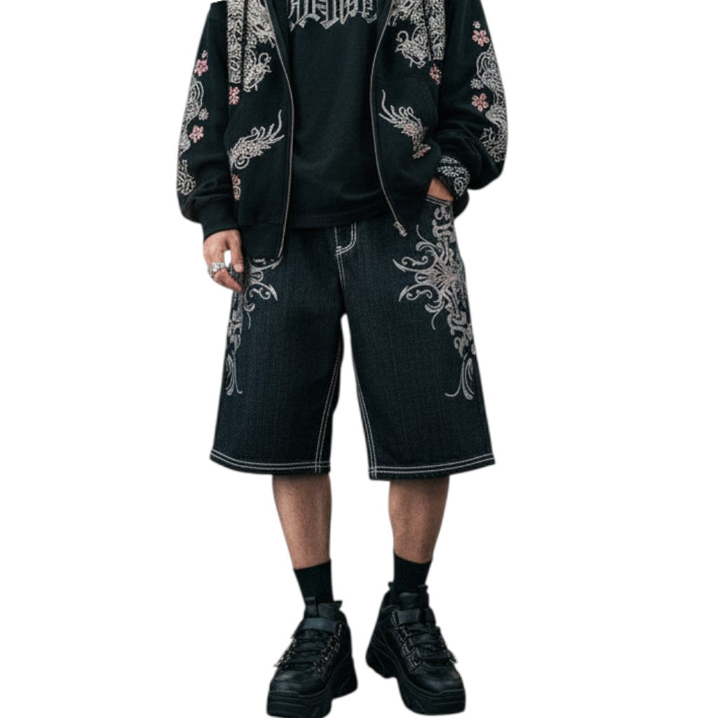 AuraXclusive Rapture denim jorts in black with white contrast stitching and intricate embroidery in a loose fit