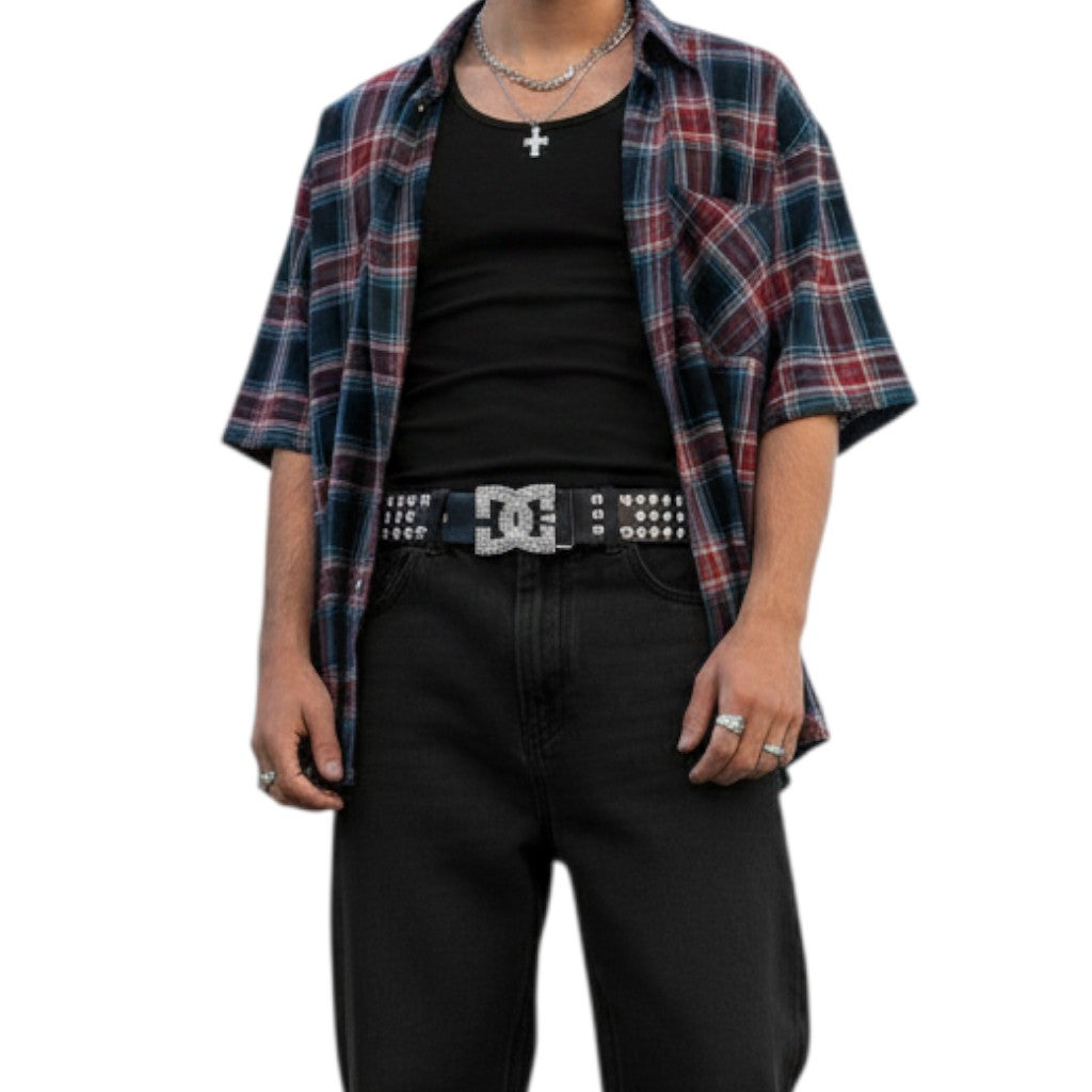 AuraXclusive Y2K style black leather belt with a large rhinestone-encrusted buckle worn by a person in a plaid shirt