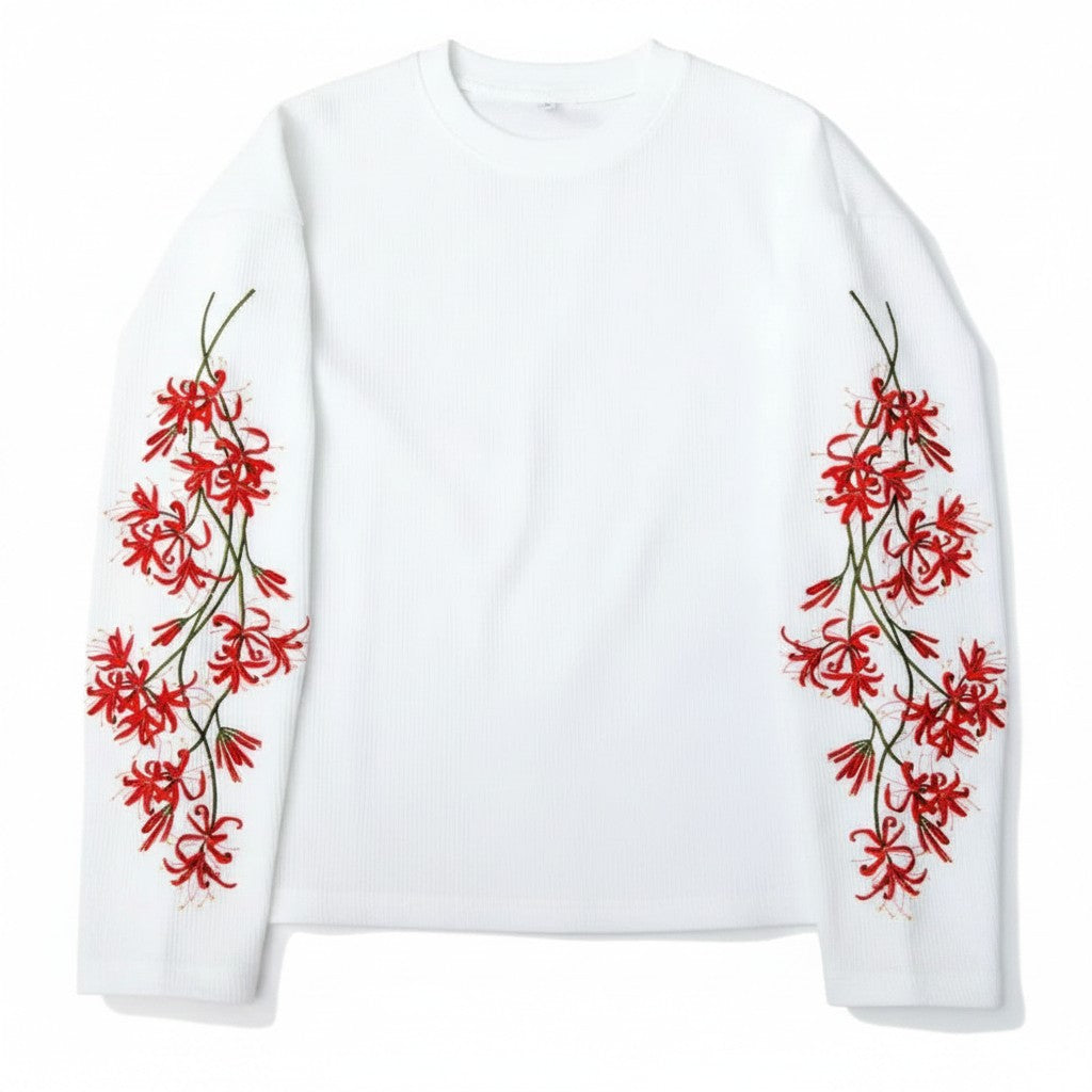 AuraXclusive white waffle knit long sleeve top featuring red cherry blossom floral embroidery on both sleeves.