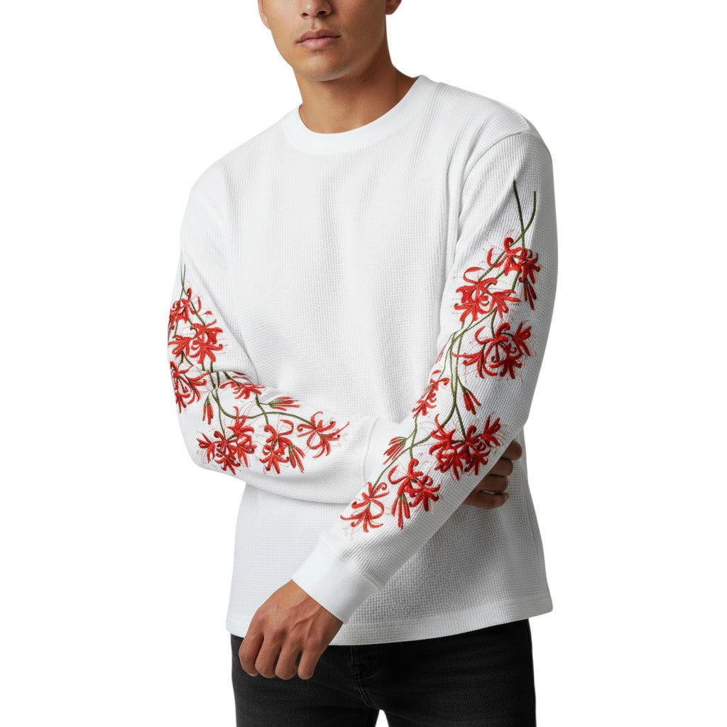 AuraXclusive white waffle knit long sleeve top featuring red cherry blossom floral embroidery on the sleeves.